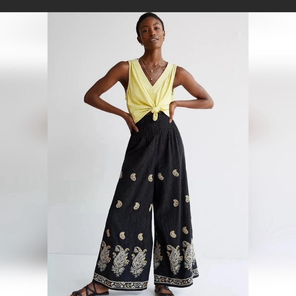 NWT Anthropologie black flare pants with yellow motif and embroidery size S